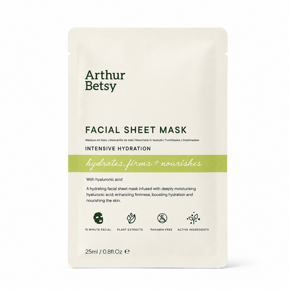 Arthur Betsy Intensive Hydration Facial Sheet Mask in a 25ml single-use stand-up pouch, featuring a cream-colored packaging with green and black text and a light green horizontal accent band. Arthur Betsy moisturising facial sheet mask with sodium hyaluronate, aloe vera, peptides and botanical extracts for hydrated, refreshed-looking skin in 15 minutes.