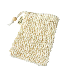 A cream-colored reusable mesh soap bag with a drawstring closure and a wooden bead. Plant-based exfoliating soap bag for the bath or shower, helping remove dead skin cells and leave the skin feeling smoother and refreshed.