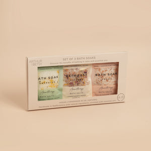 A pack of three Arthur Betsy aromatherapy bath soaks with green and pink labeling, presented in a light-colored box.