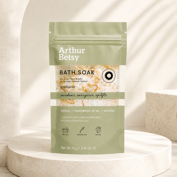 Handmade herbal bath salts with natural salts, dried calendula and citrus essential oils, presented in a printed single-use bath soak pouch.
